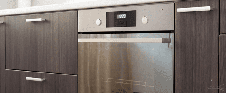 ADH-Kitchen cabinets with metal handles and built-in electric oven