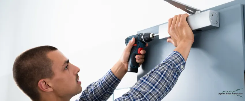 ADH - Man Installing a Door Closer